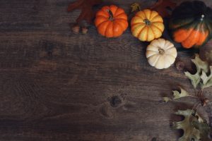 pumpkins-on-dark-wood-background